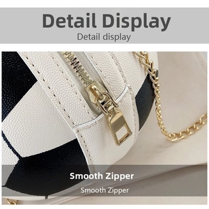 Detail shot of smooth gold zipper and textured lychee leather on basketball-shaped bag