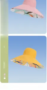 Detail of pink and yellow wide brim sun hats with tropical floral reversible lining