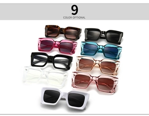 Flat lay of square chunky sunglasses in nine colors including tortoiseshell and clear frames