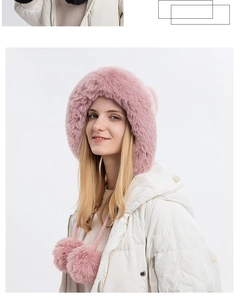 Detailed view of pink fuzzy winter hood with thick lining and soft faux fur pom-poms