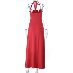 Detail of red halter neck maxi dress featuring open back design and slim fit cut