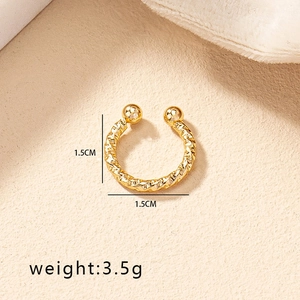 Detailed view of gold textured geometric clip-on lip ring with weight and size info