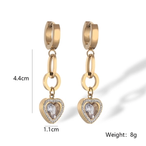 Detail view of 4.4cm long gold-plated heart earrings with pave zircons and drop design