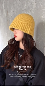 Detail of high-elasticity bright yellow knitted bucket hat with vertical ribbing texture