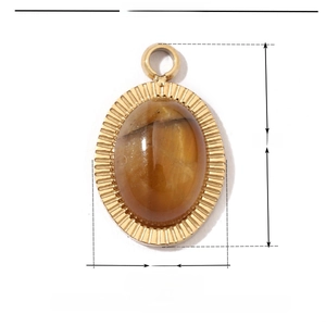 Detail view of oval stainless steel pendant with amber natural stone and sunburst engraving