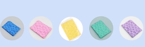 Detail view of five colored absorbent pet towels with cute cartoon animal prints