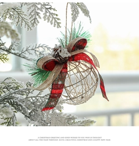 Close-up of rustic Christmas ball with plaid bow, pine needles, and pinecone decoration