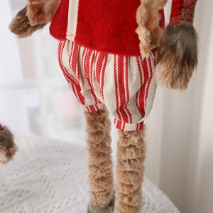 Charming long-legged Christmas reindeer doll with red felt texture and knitted striped pants
