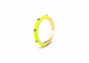 Detail of neon yellow enamel ring with sparkling zircon stones and gold plating