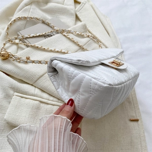 Chic white quilted crossbody bag with golden chain strap and metallic lock closure