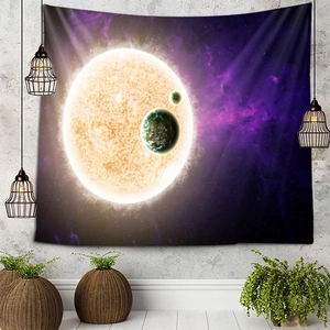 Cosmic star tapestry with glowing sun and planets hanging on a modern grey wall