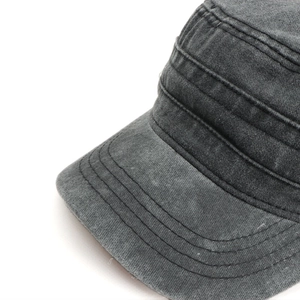 Macro shot of reinforced stitching and washed gray cotton fabric on flat top cadet cap