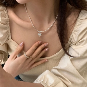 Elegant heart pendant necklace with pearls and matching silver rings set for women