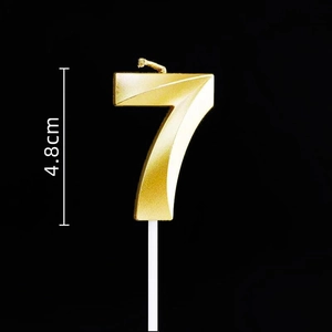 Detail of golden number 7 birthday candle with geometric facets and 4.8cm height scale