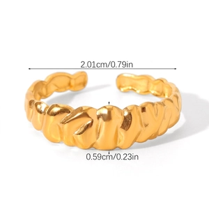 Macro view of gold-plated croissant ring showing twisted texture and dimensions