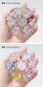 Detail view of 7-grid nail art kit with aurora bears, pearls and floral sequins