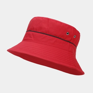 Close-up of red quick-dry bucket hat featuring black trim and silver metal air vents