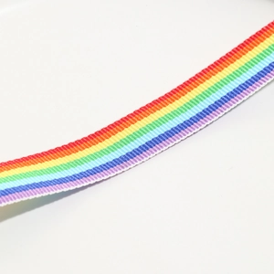 Close-up detail of the vibrant rainbow woven fabric strap with high-density texture