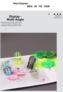 Detailed view of three gold alloy rings with zircon stones on acrylic display stands