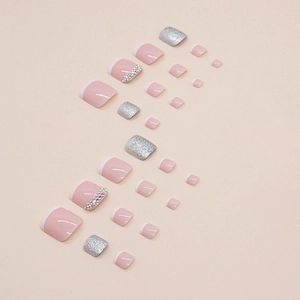 Faux ongles d'orteils roses brillants style français avec paillettes et strass