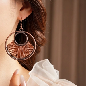 Vintage bronze round hollow hoop earrings with brown woven ethnic design for women