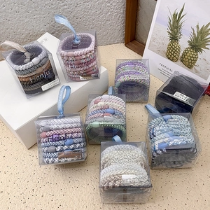 8-pack woven elastic hair ties set in gift boxes featuring various vibrant color palettes