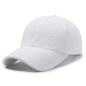 Minimalist white baseball cap with textured seersucker fabric and curved brim