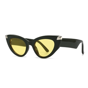 Retro cat-eye sunglasses with glossy black frames and bright yellow transparent lenses