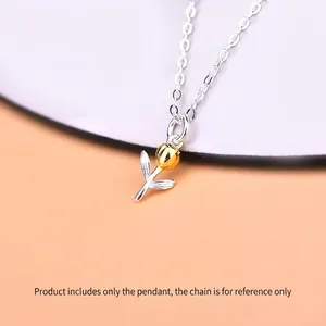 Elegant 925 silver tulip pendant with gold flower bud on a minimalist beige background