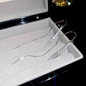 Elegant silver long chain tassel earrings with sparkling zircon drops in a velvet jewelry box
