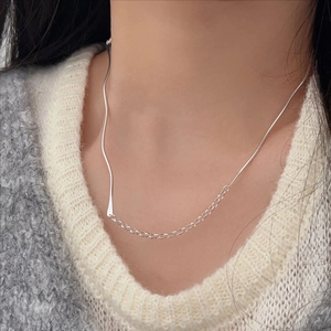 Minimalist 925 sterling silver asymmetrical snake chain necklace on female model