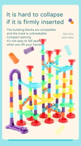 Detail of colorful marble run tower showing stable connections and various track components