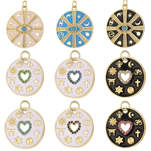 Macro shot of circular gold pendants with colorful enamel and inlaid zircon evil eye symbols