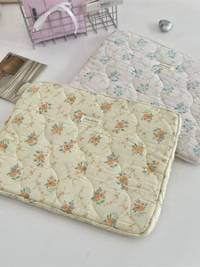 Quilted floral tablet sleeve with rabbit embroidery in beige and blue floral patterns