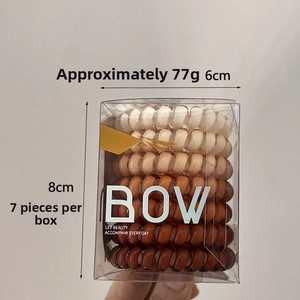 7-piece spiral hair tie set in earthy tones within a 6x8cm transparent gift box
