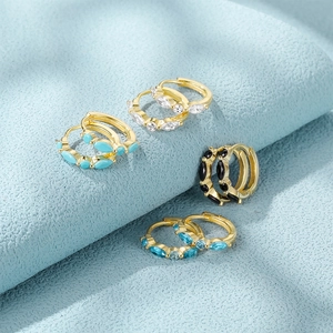 Detailed macro shot of S925 silver hoop earrings with marquise-cut colorful zircons