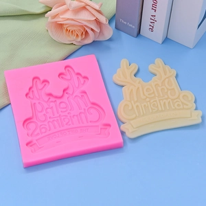 Christmas silicone mold featuring Merry Christmas and reindeer antler embossed text design