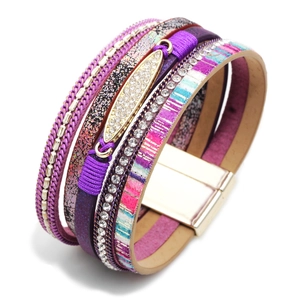 Detail of purple and pink multi-layer bracelet with gold magnetic clasp and crystal charms