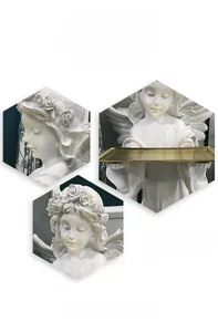 Detail of white resin angel statue holding a gold metal tray with floral wreath accents