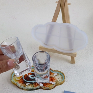Detailed view of cloud-shaped silicone mold and DIY resin tray with gold foil accents
