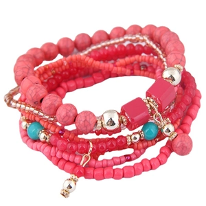 Bohemian multilayer beaded bracelet set with pink and turquoise seeds and gold accents