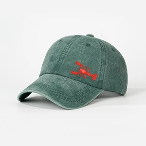 Vintage washed green cotton baseball cap with red lobster embroidery in a minimalist style