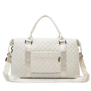 White quilted travel bag with dual handles and detachable shoulder strap for gym and sports