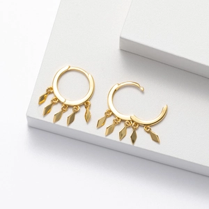 Detailed macro view of S925 silver hoop earrings with five gold rhombus leaf tassels
