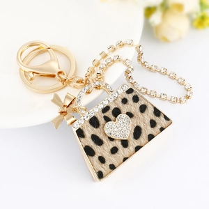 Leopard print handbag keychain with gold alloy finish and sparkling rhinestones
