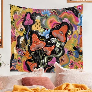 Detail view of psychedelic mushroom and eye pattern tapestry hanging in a cozy bedroom