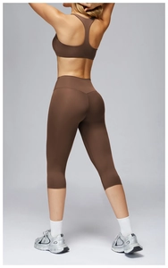 Rear view of dark brown high-waist yoga set with racerback bra and cropped leggings