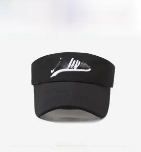 Detail of white Andyou letter embroidery on breathable black cotton sun visor hat