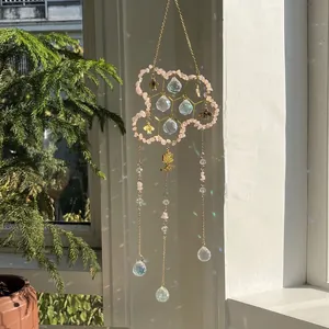Golden honeycomb suncatcher with pink natural crystals and prism balls for window decor