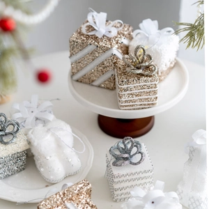 Champagne and white Christmas gift box ornaments with glitter and bows for tree decor